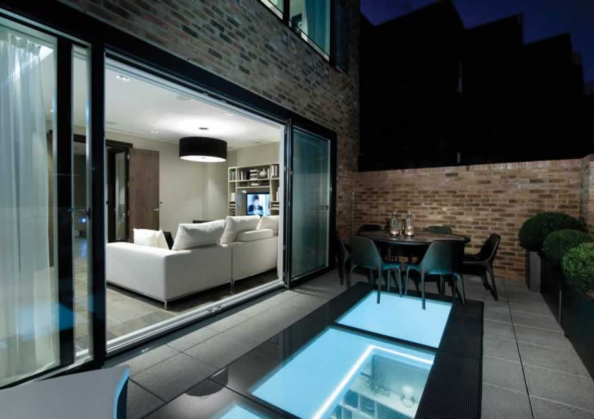 a fully underground basement extended under te garden with a walk-on rooflight showing the basement conversion below the garden